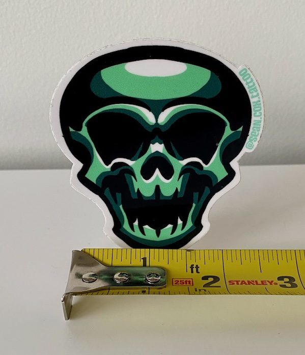green-skull-size-sticker-tattoo-vancouver Green skull sticker with tape measure