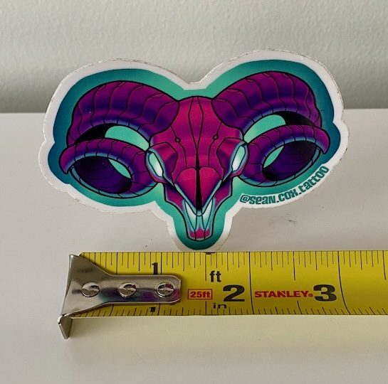 ram-skull-size-sticker-tattoo-vancouver Purple ram skull sticker with tape measure