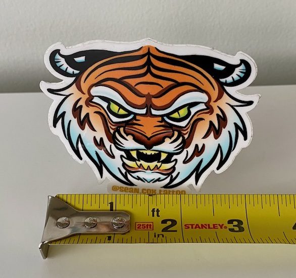 tiger-size-sticker-tattoo-vancouver Tiger head sticker with tape measure