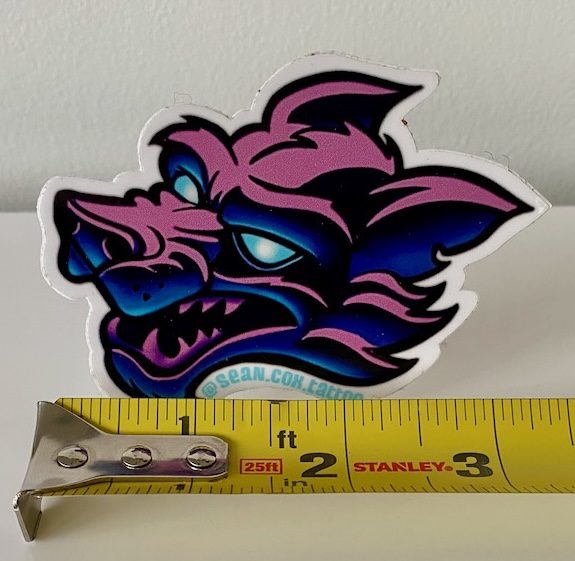 wolf-size-sticker-tattoo-vancouver Pink and blue wolf head sticker with tape measure