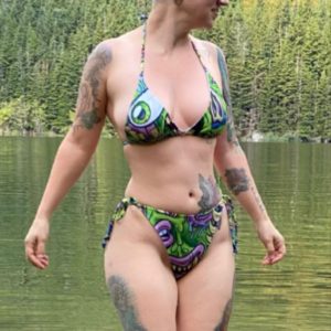 Woman in Green Monster Bikini standing in water