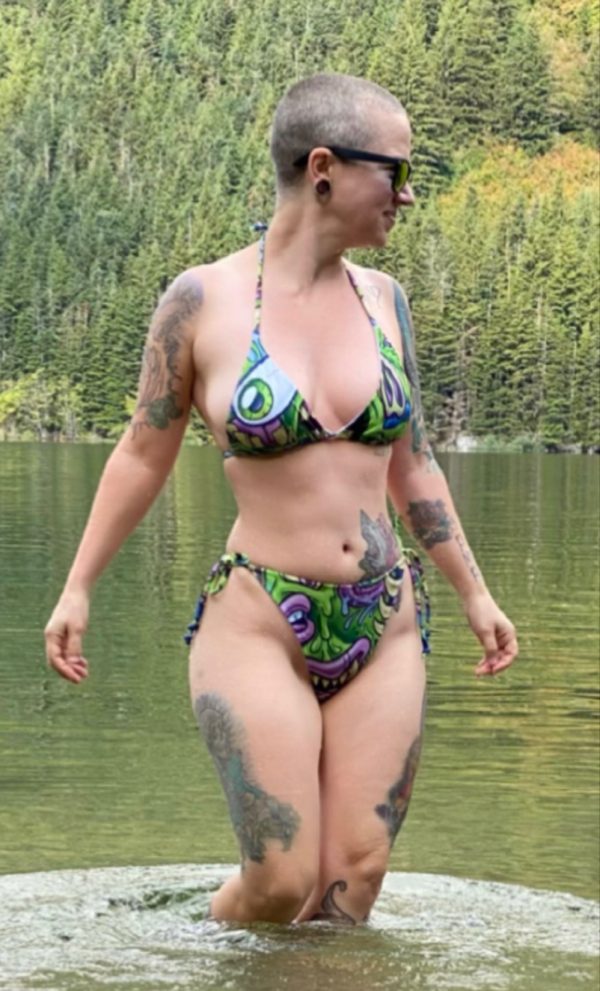 Woman in Green Monster Bikini standing in water