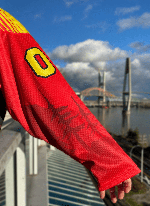 left sleeve of red Vancouver spaghetti whale hockey jersey