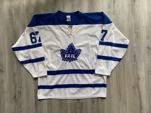 White and blue hockey jersey with “FAIL” maple leaf logo.