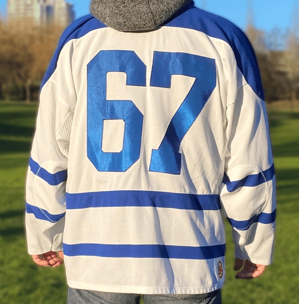 White and blue hockey jersey with “FAIL” maple leaf logo.