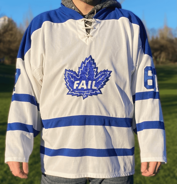 White and blue hockey jersey with “FAIL” maple leaf logo.