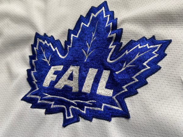 White and blue hockey jersey with “FAIL” maple leaf logo.