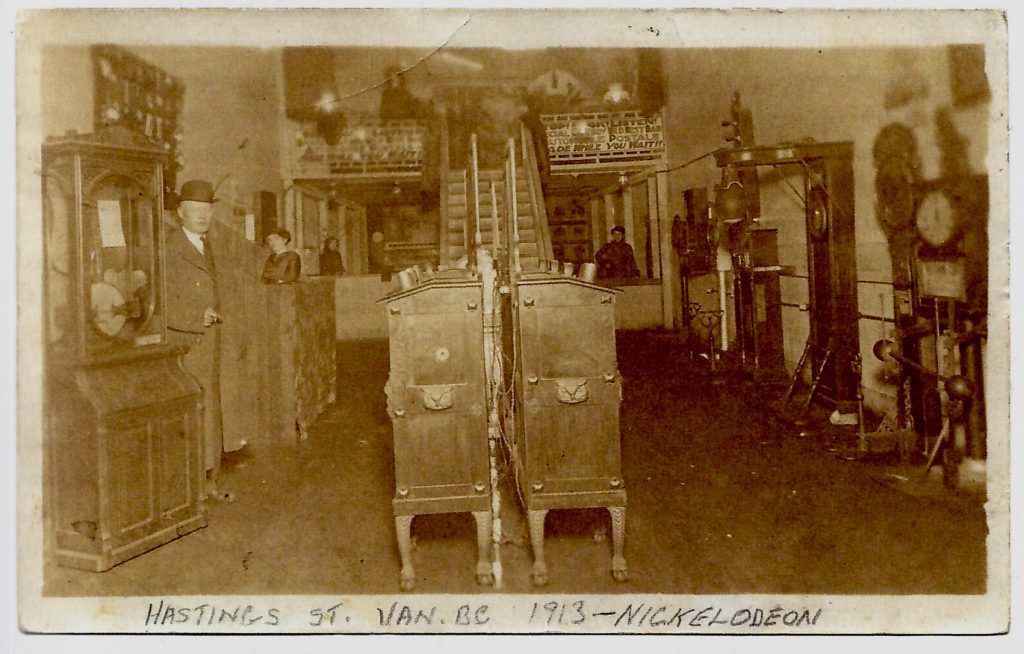 1913 Vancouver arcade with games and nickelodeon machines.