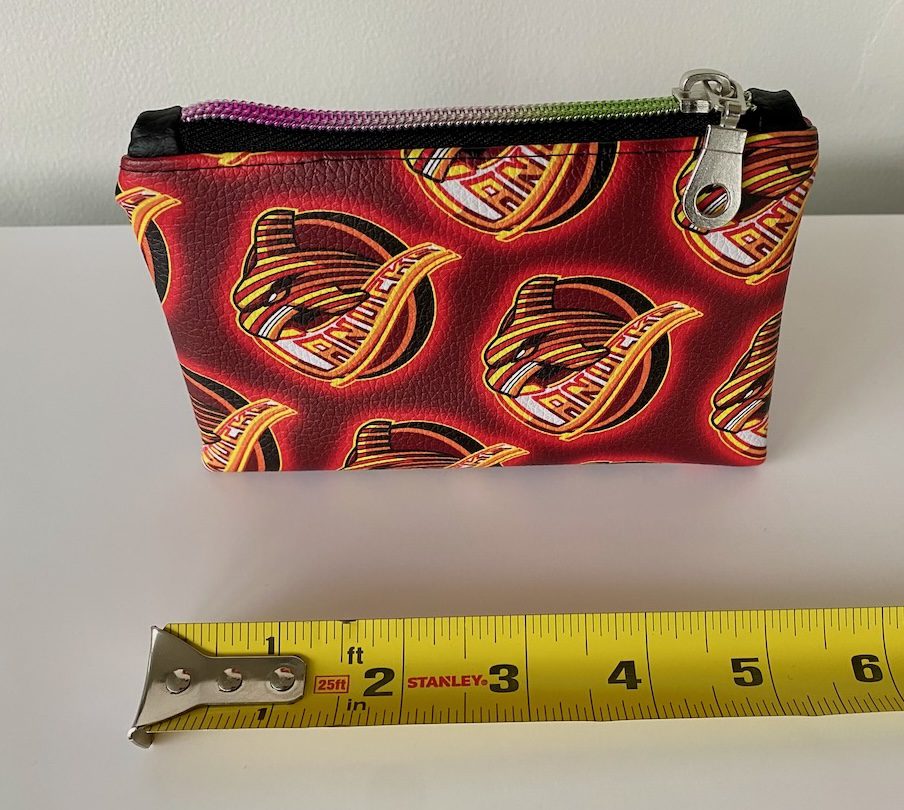 spaghetti-whale-stash-bag-tattoo-new-westminster-size Spaghetti Whale stash bag with tape measure showing size.