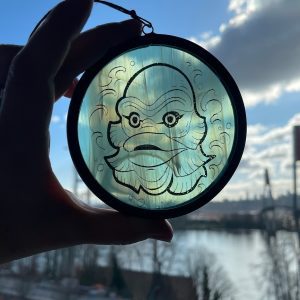 Creature glass round against sky, vertical texture