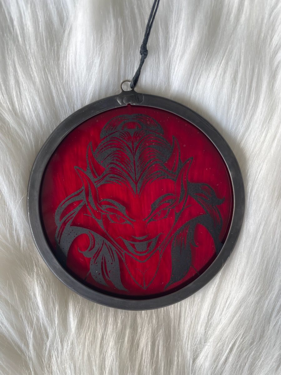 sean-cox-tattoo-glass-art-she-devil-1-front-fur Red devil glass round on fur background