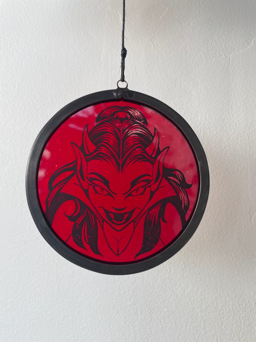 sean-cox-tattoo-glass-art-she-devil-1-front-wall Red devil glass round on white wall background