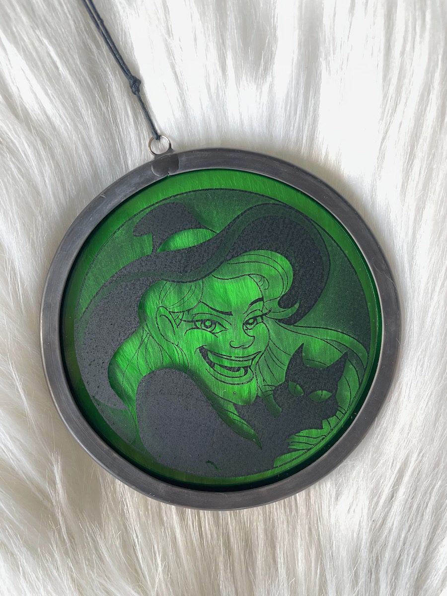 sean-cox-tattoo-glass-art-witch-1-front-fur Green witch glass round on fur surface