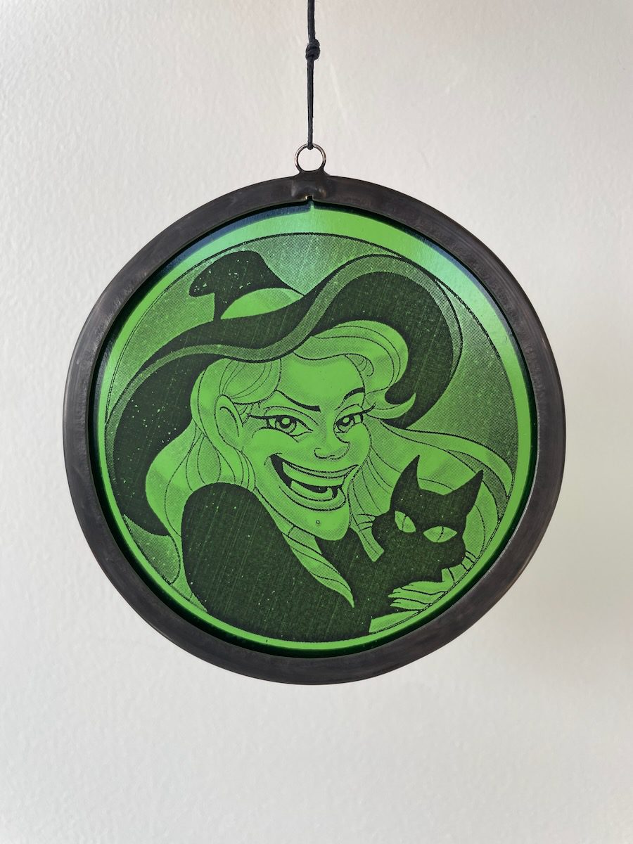 sean-cox-tattoo-glass-art-witch-2-front-wall Green witch glass round on white wall